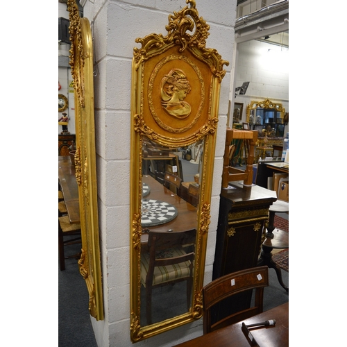 530 - A GOOD PAIR OF GILTWOOD LONG NARROW MIRRORS with a large circular portrait. 6ft high x 1ft 6ins wide... 