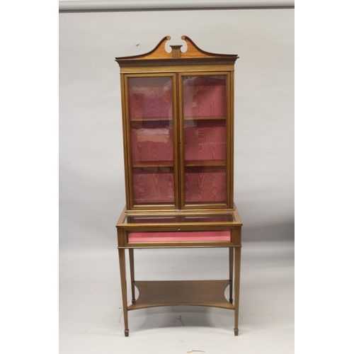 536 - AN EDWARDIAN MAHOGANY CHINA AND BIJOUTERIE CABINET, the top with glass panel doors, two glass shelve... 