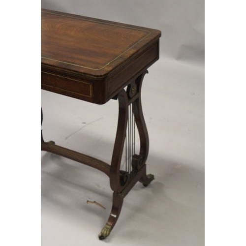 539 - A GOOD REGENCY MAHOGANY WRITING TABLE with plain crossbanded top and fitted frieze drawer, with leat... 