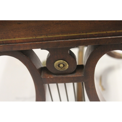 539 - A GOOD REGENCY MAHOGANY WRITING TABLE with plain crossbanded top and fitted frieze drawer, with leat... 