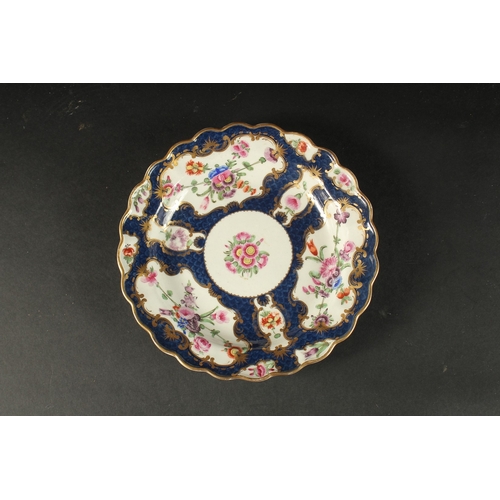 556 - A GOOD FIRST PERIOD WORCESTER DISH, rich blue and floral body. Square mark in blue. 7.5ins diameter.... 