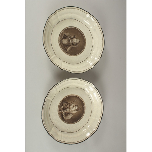 560 - A PAIR OF FRENCH PORCELAIN DISHES, decorated to the centre with a portrait. 29cms diameter.