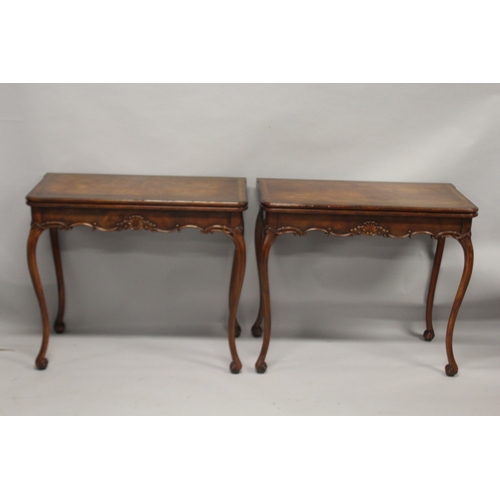 532 - A GOOD PAIR OF IRISH MAHOGANY FOLDING TOP CARD TABLES, with plain top and leather interior embossed ... 