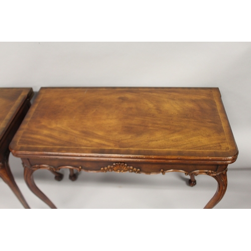 532 - A GOOD PAIR OF IRISH MAHOGANY FOLDING TOP CARD TABLES, with plain top and leather interior embossed ... 