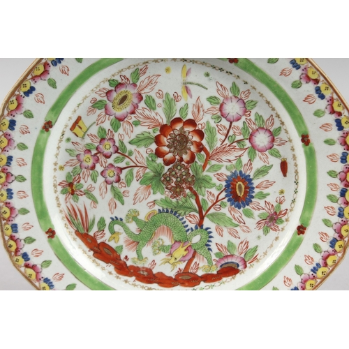 1 - A 19TH CENTURY CHINESE CLOBBERED PORCELAIN PLATE, painted with dragon and flora, 24.5cm wide.