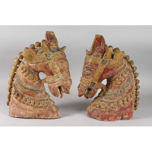 100 - A LARGE PAIR OF 19TH CENTURY SOUTH INDIAN POLYCHROMED CARVED WOOD HORSE HEADS, each approx. 37cm hig... 