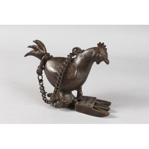 102 - A 19TH CENTURY INDIAN BRONZE CHICKEN SHAPE OIL LAMP, bronze 20cm wide.