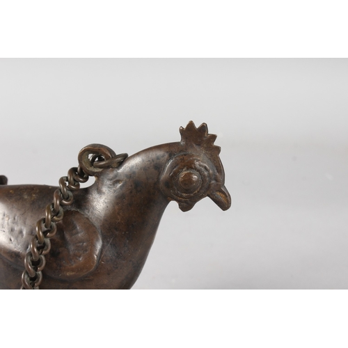 102 - A 19TH CENTURY INDIAN BRONZE CHICKEN SHAPE OIL LAMP, bronze 20cm wide.