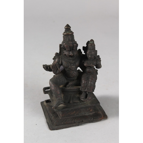 108 - A FINE 18TH-19TH CENTURY SOUTH INDIAN BRONZE FIGURE OF A DEITY, with consort, 12.5cm high.