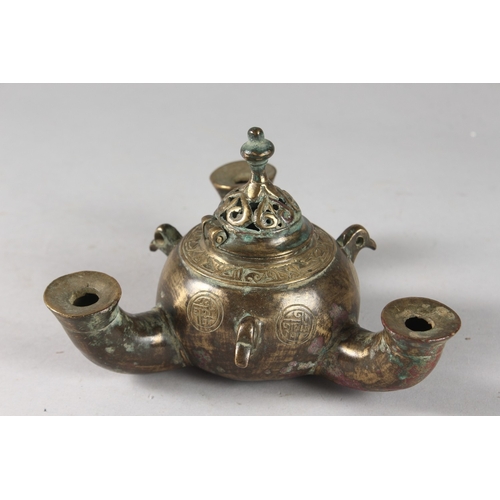 114 - A RARE AND UNUSUAL 12TH-13TH CENTURY PERSIAN SELJUK BRONZE TRIPLE SPOUTED OIL LAMP, with bird head t... 