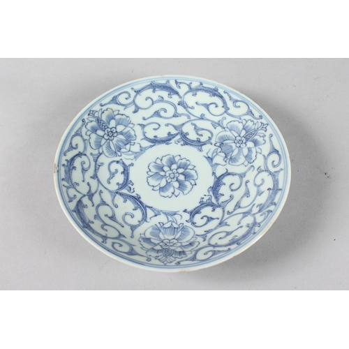 12 - A 19TH CENTURY CHINESE BLUE AND WHITE PORCELAIN DISH, with floral motifs, the base with six-characte... 