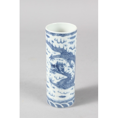 13 - A 19TH CENTURY CHINESE PORCELAIN CYLINDRICAL VASE / BRUSH POT, finely painted with dragon, the base ... 