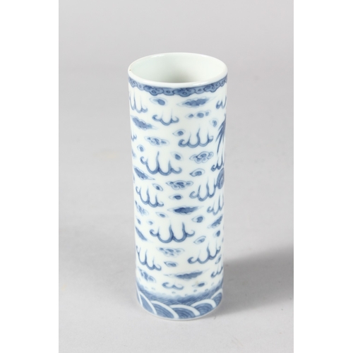 13 - A 19TH CENTURY CHINESE PORCELAIN CYLINDRICAL VASE / BRUSH POT, finely painted with dragon, the base ... 