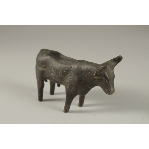 133 - A POSSIBLY ANCIENT LURISTAN OR INDUS VALLEY BRONZE BULL, 13.5cm long.