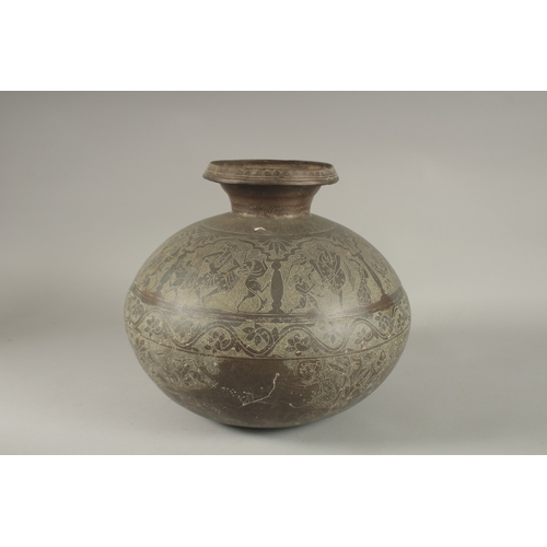 143 - A LARGE AND RARE 18TH CENTURY NORTH INDIAN RAJASTAN BRASS LOTA, engraved with dancers and mythical c... 