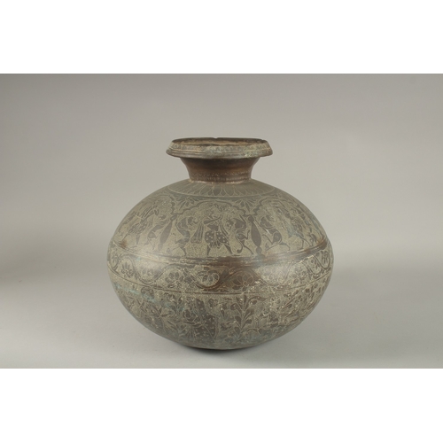 143 - A LARGE AND RARE 18TH CENTURY NORTH INDIAN RAJASTAN BRASS LOTA, engraved with dancers and mythical c... 