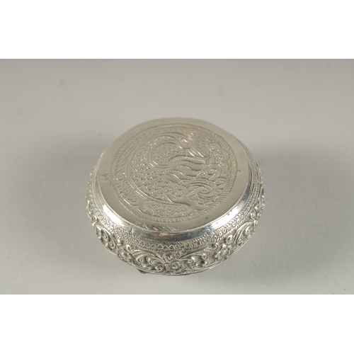 145 - A FINELY ENGRAVED INDIAN OR SRI LANKAN SILVER SNUFF BOX, 5.5cm wide.