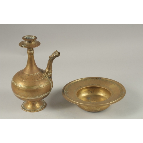 148 - A 17TH CENTURY MUGHAL INDIAN BRASS OR BRONZE EWER AND BASIN, ewer 24cm high, (2).