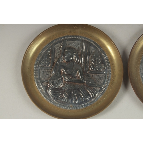 151 - A PAIR OF 19TH CENTURY INDIAN TANJORE SILVER MOUNTED BRASS DISHES, 8.5cm diameter each.