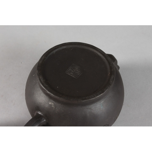 166 - A CHINESE BLACK YIXING TEAPOT, with impressed mark to base.