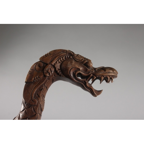 167 - A CARVED DRAGON FORM WOODEN CANE, 98cm long.