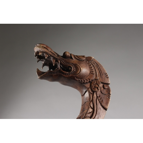 167 - A CARVED DRAGON FORM WOODEN CANE, 98cm long.