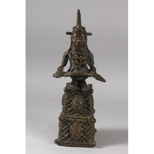 168 - A BENIN FIGURAL BRONZE BELL, 38cm high.