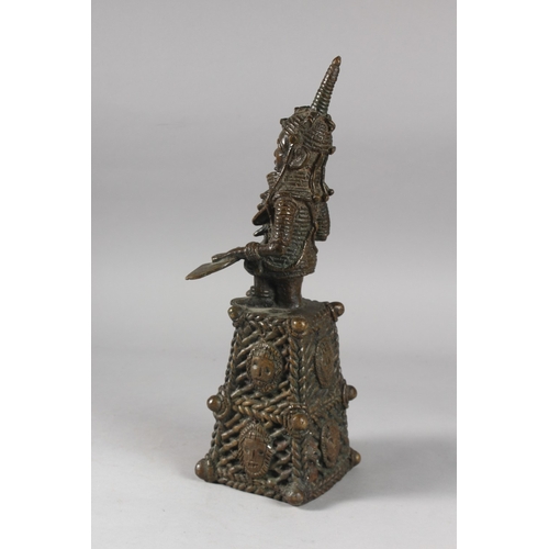 168 - A BENIN FIGURAL BRONZE BELL, 38cm high.