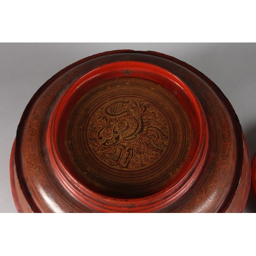 171 - A LARGE 19TH-20TH CENTURY BURMESE RED LACQUER CIRCULAR BOX, comprising of four pieces, 36cm diameter... 