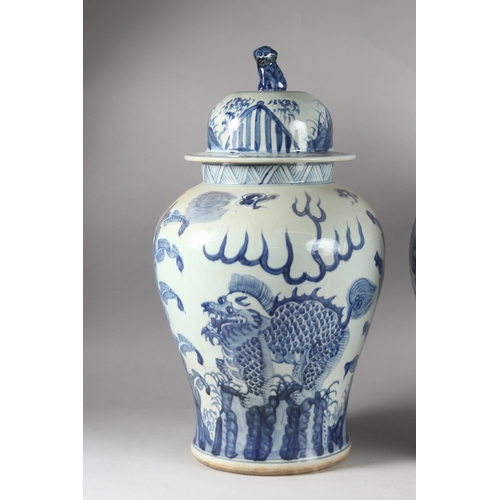 174 - A VERY LARGE PAIR OF CHINESE BLUE AND WHITE PORCELAIN JARS AND COVER, decorated with dog of fo, 52cm... 