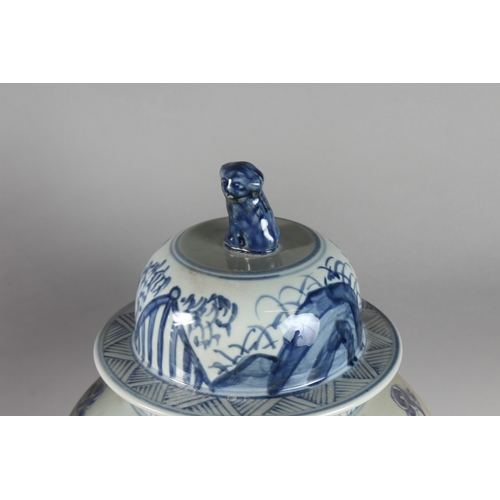 174 - A VERY LARGE PAIR OF CHINESE BLUE AND WHITE PORCELAIN JARS AND COVER, decorated with dog of fo, 52cm... 