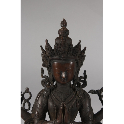 179 - A VERY LARGE BRONZE SEATED DEITY ON A LOTUS BASE, 48cm high.