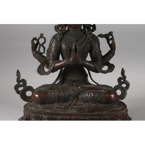 179 - A VERY LARGE BRONZE SEATED DEITY ON A LOTUS BASE, 48cm high.