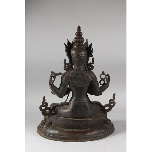 179 - A VERY LARGE BRONZE SEATED DEITY ON A LOTUS BASE, 48cm high.