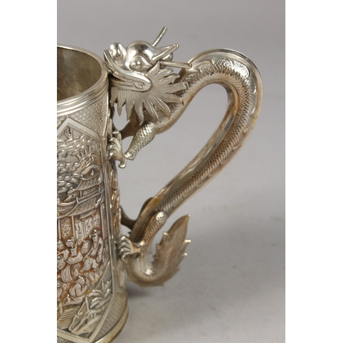 182 - A VERY FINE CHINESE SILVER TANKARD, with cast dragon form handle, finely engraved with relief panels... 