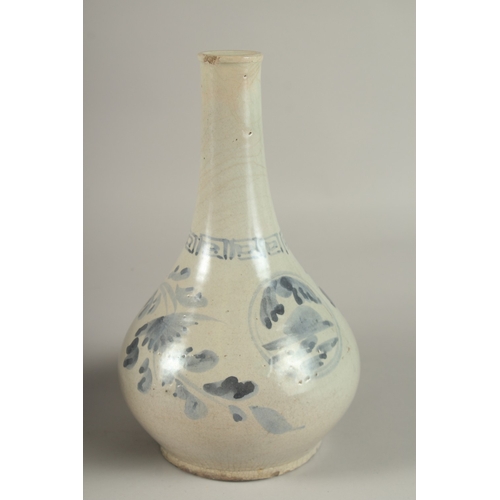 194 - TWO BLUE AND WHITE GLAZED PORCELAIN BOTTLES, 27cm high.