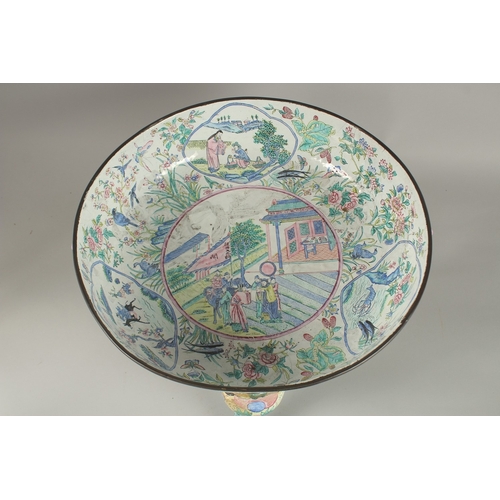 198 - A VERY LARGE CHINESE CANTON ENAMELLED BOWL, raised on curving tripod legs with shaped beast head han... 