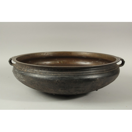 201 - A LARGE 19TH CENTURY INDIAN OR SOUTH EAST ASIAN BRONZE TWIN HANDLE URLI, 59cm diameter. *Note: a sim... 