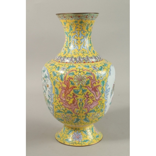 204 - A CHINESE YELLOW GROUND ENAMELLED VASE, painted with a panel depicting an exotic bird and flora, fur... 