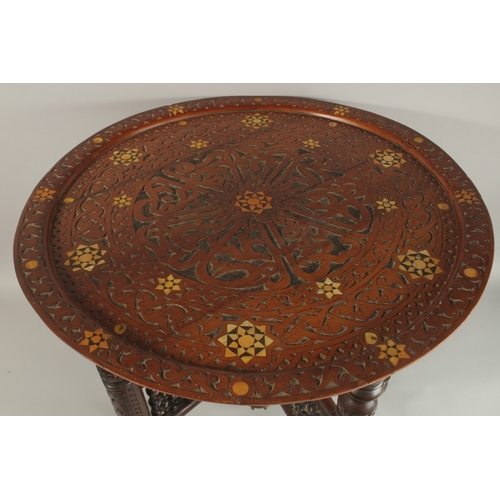 211 - A FINE 19TH CENTURY SYRIAN DAMASCUS MOTHER OF PEARL INLAID WOODEN TABLE, with folding legs.