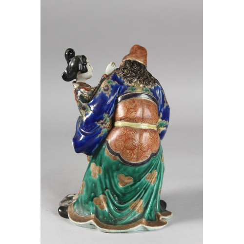 217 - A 19TH CENTURY JAPANESE KUTANI PORCELAIN FIGURAL GROUP, 25.5cm high.