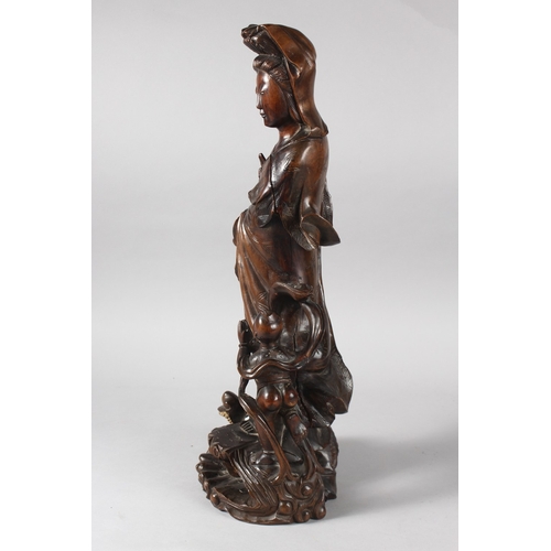 22 - A 19TH CENTURY CHINESE CARVED ROOTWOOD GUANYIN FIGURE, stood upon a dragon-like beast with inset eye... 