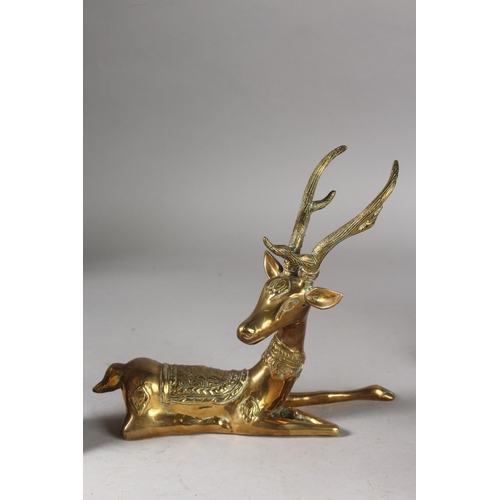 225 - A PAIR OF BRASS DEER, together with three brass immortals with wooden stands, (5).