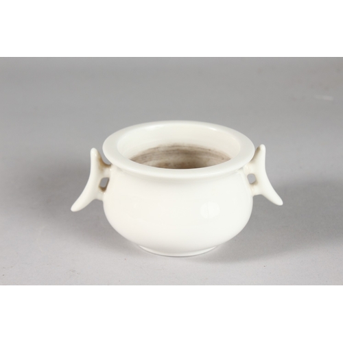 228 - A SMALL CHINESE BLANC DE CHINE TWIN HANDLE CENSER, with impressed mark to base, 12cm handle to handl... 