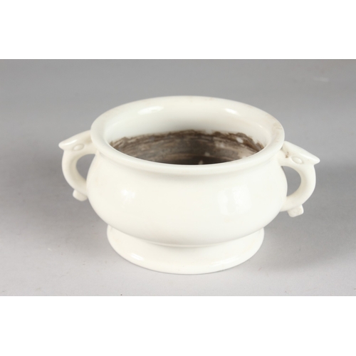 229 - A CHINESE BLANC DE CHINE TWIN HANDLE CENSER, with impressed mark to base, 17cm handle to handle.