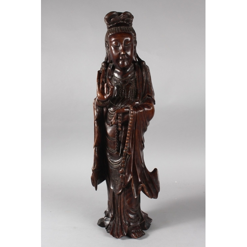 23 - A LARGE 19TH CENTURY CHINESE CARVED HARDWOOD FIGURE, 57cm high.