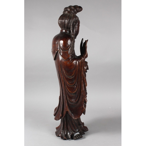 23 - A LARGE 19TH CENTURY CHINESE CARVED HARDWOOD FIGURE, 57cm high.