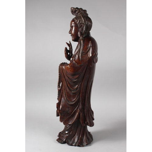 23 - A LARGE 19TH CENTURY CHINESE CARVED HARDWOOD FIGURE, 57cm high.