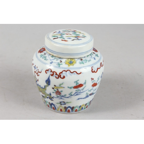 239 - A CHINESE DOUCAI PORCELAIN POT AND COVER, 10cm high.