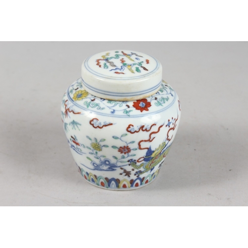 239 - A CHINESE DOUCAI PORCELAIN POT AND COVER, 10cm high.